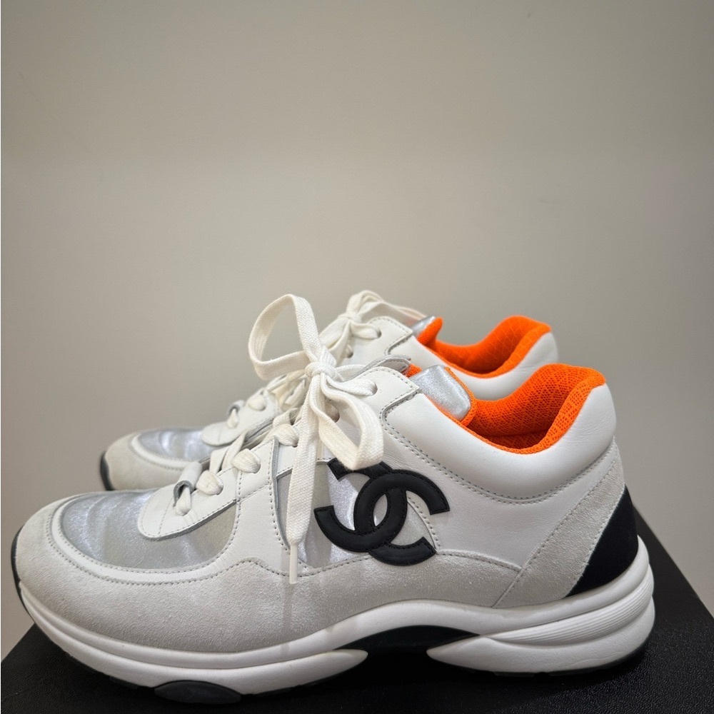 Chanel white black & silver iridescent Sneakers w/ vibrant orange lining
